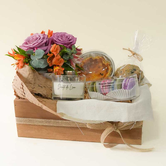 Regalo de flores, vela y postres